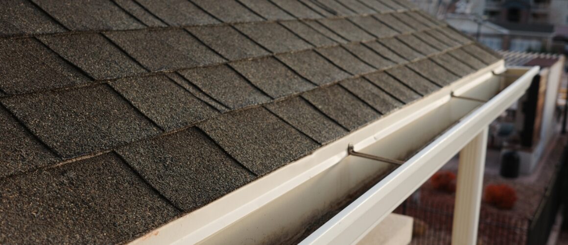 Shingles,And,Gutter,Work,On,An,Apartment