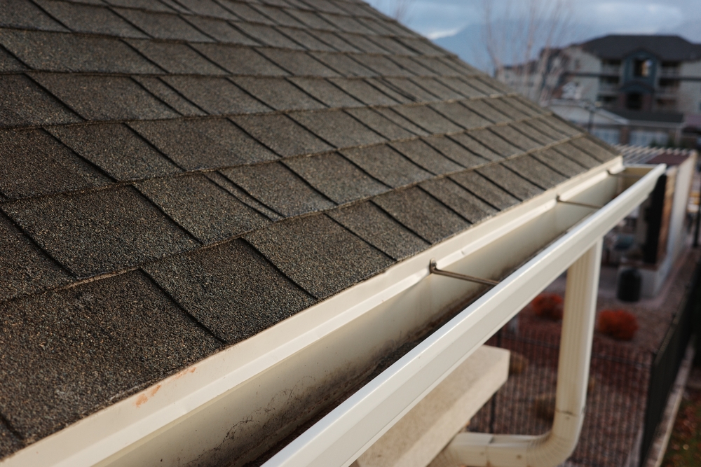 Shingles,And,Gutter,Work,On,An,Apartment