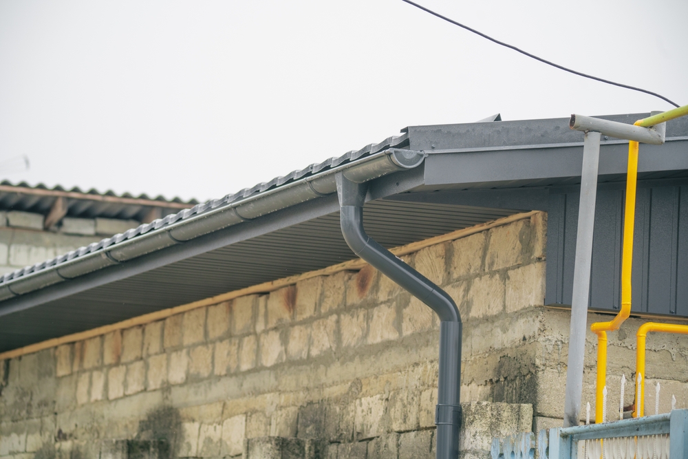 Close-up,View,Of,A,Roof,Gutter,On,A,Stone,Building